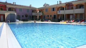 Colorful apartment with fenced garden and fireplace Bibione